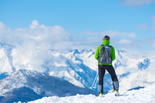 cross-country skier at mountain top