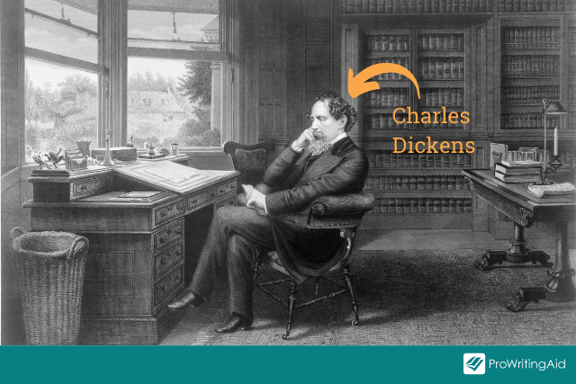 Charles Dickens sat at his writing desk